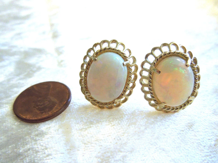 Oval White Opal in 14K Yellow Gold French Back Earrings