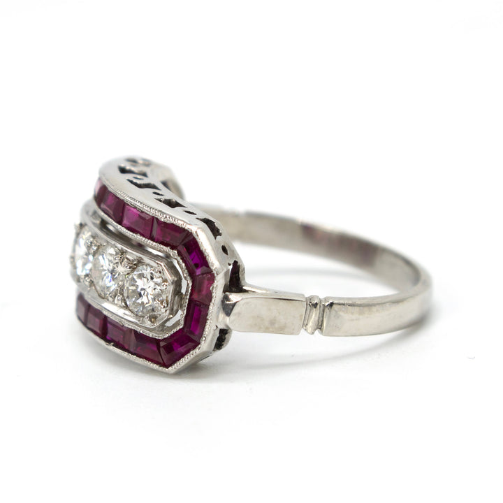 Art Deco Five Diamond Ring with Calibre Cut Ruby Surround in Platinum