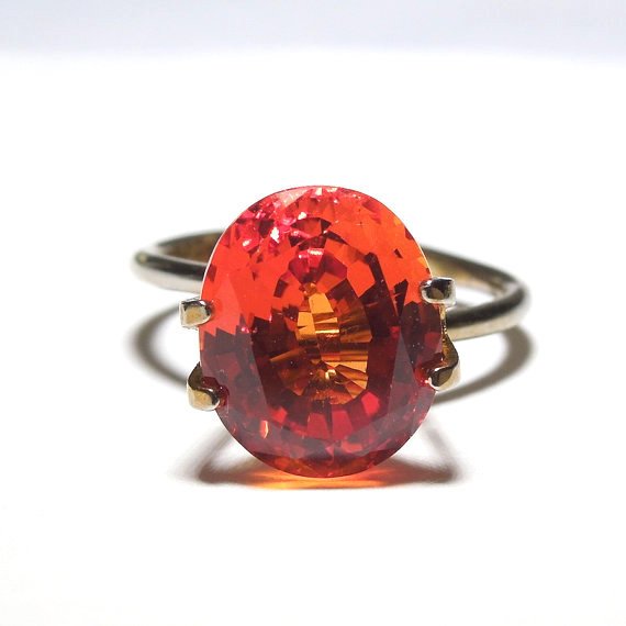 5.77 ct Rich Orange Red Oval Cut Sapphire