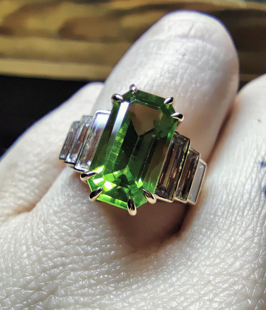 4.58 Carat Elongated Emerald Cut Peridot in Art Deco Style Yellow Gold Mounting with Baguettes